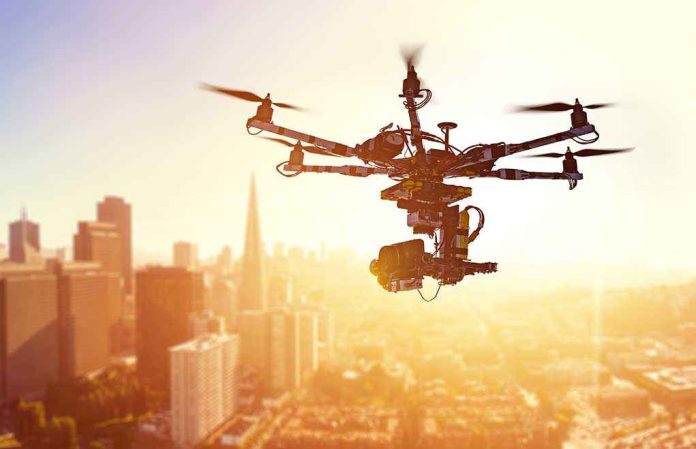 shutterstock_415195669-2- A drone flying over a city skyline during sunset