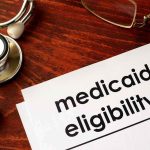 NEW, UNBELIEVABLE Medicaid HORROR Exposed Medicaid eligibility form with stethoscope and pen on desk