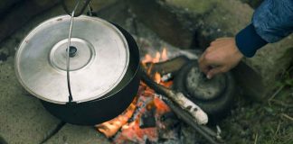 campfire with pot and kettle