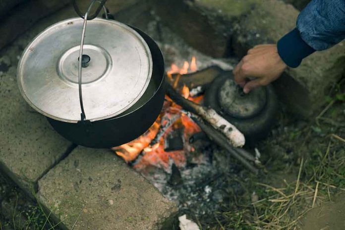 campfire with pot and kettle