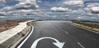 Knife Rampage IGNITES City—Then UNFORESEEN U-Turn Curved road with a U-turn arrow marking.