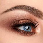 close-up of a blue eye with bronze eyeshadow