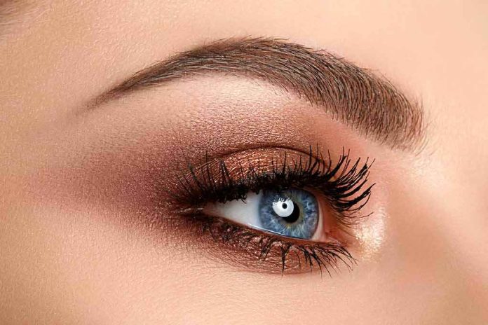 shutterstock_1024369165 close-up of a blue eye with bronze eyeshadow