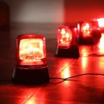 Red emergency beacons on a floor