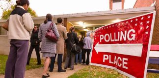 People lining up outside a polling place