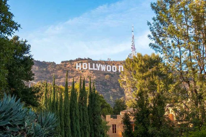 Hollywood Sign on hillside framed by trees