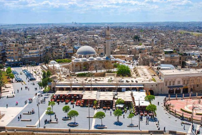 shutterstock_1244148310 historic mosque with domes and minaret overlooking a busy city square