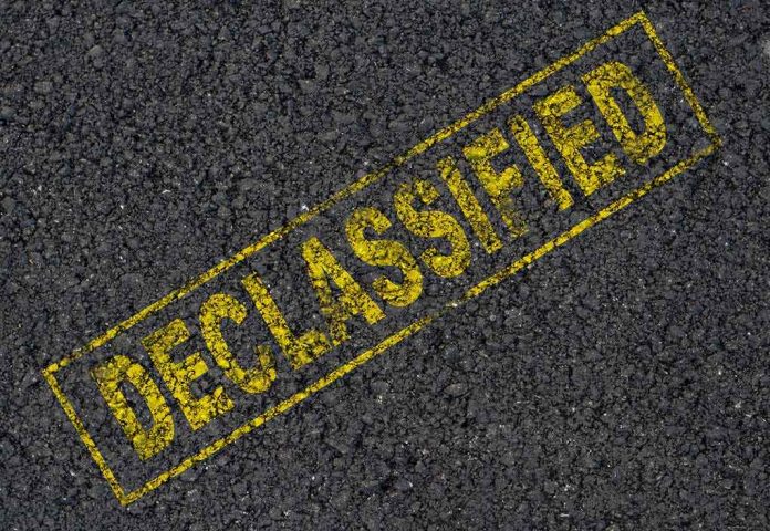 shutterstock_127158449 Declassified stamp on rough asphalt surface