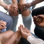 New Law BANS Prayer — WHAT??! Group holding hands in a supportive circle