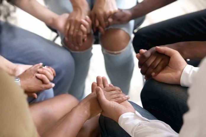 Group holding hands in a supportive circle