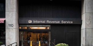 Shocking CRACKDOWN Looms For ELITE Nonprofits Entrance of the Internal Revenue Service office with signage