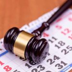 Two ISLAM HOLIDAYS Added! — Look Who’s DOING THIS! Judge’s gavel resting on a calendar