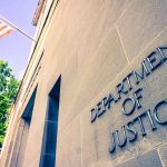 DOJ Backs Down — MAJOR 2A Win! Department of Justice building facade with American flag