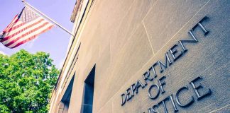DOJ Backs Down — MAJOR 2A Win! Department of Justice building facade with American flag