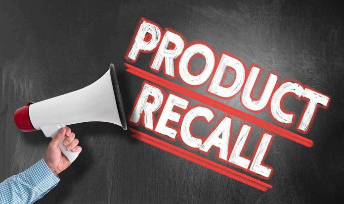 shutterstock_1411356206 megaphone announcing product recall on chalkboard