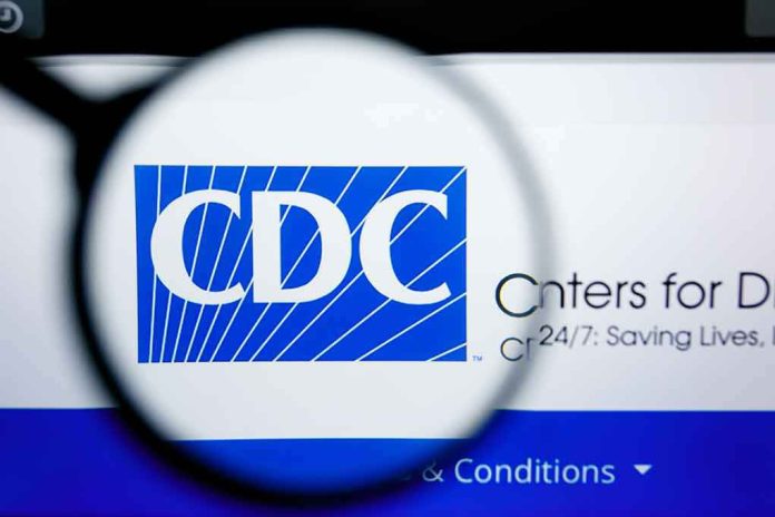 shutterstock_1450445633 Magnifying glass over CDC logo on a computer screen