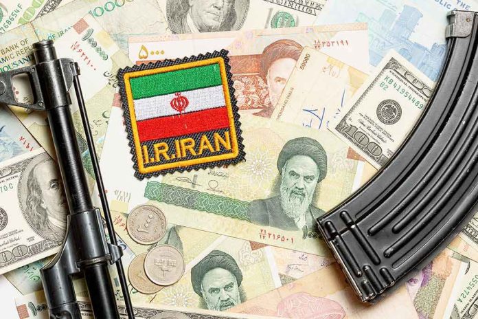 shutterstock_1525982213 Iran patch on mixed currency with rifle parts