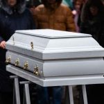 MYSTERIOUS DEATH Haunts Prestigious UNIVERSITY White casket at an outdoor funeral