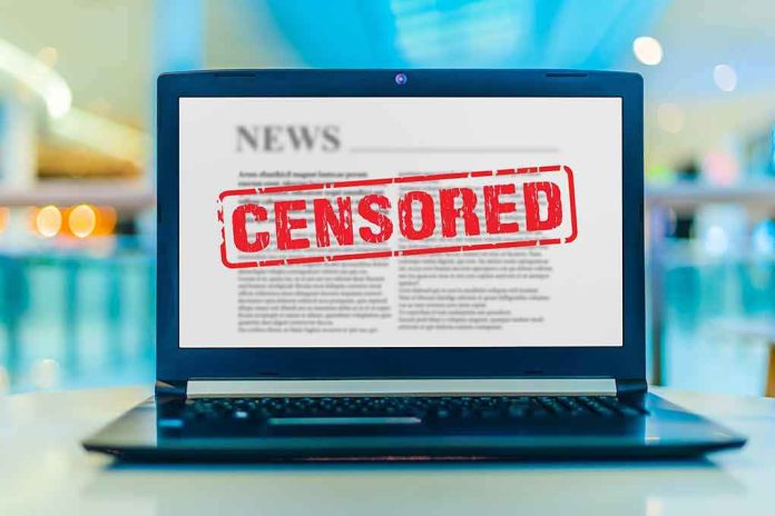 shutterstock_1715215150 Laptop displaying censored news article