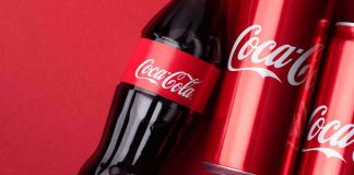 Coke’s Filter BACKFIRES — Boycott ERUPTS Coca-Cola bottle and cans on red background