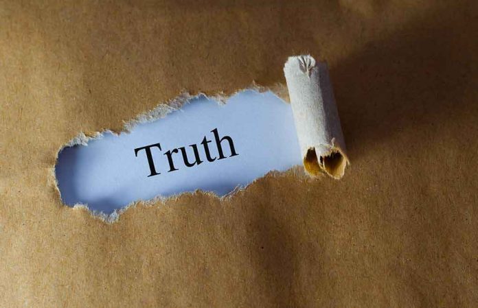 shutterstock_384729706 Torn brown paper revealing the word 'Truth' on white background