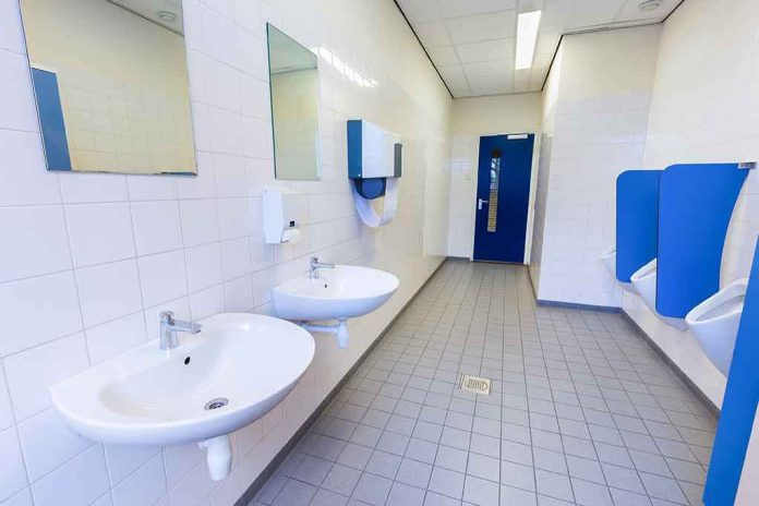 shutterstock_533753329 Public restroom with sinks and urinals