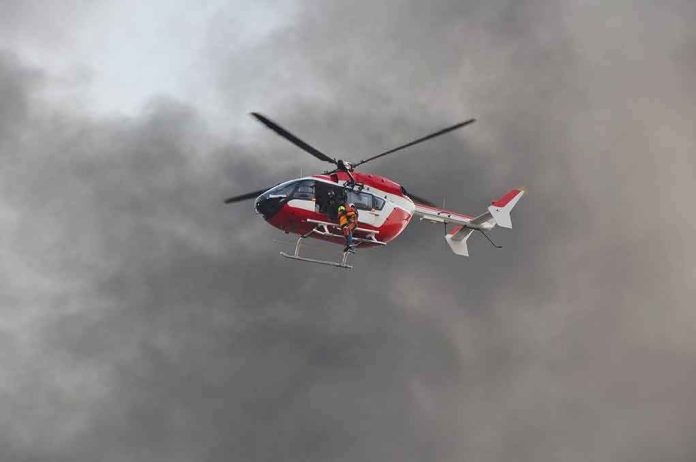 shutterstock_554743687 Rescue helicopter hovers amid thick smoke