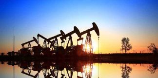 Trump Targets BIG OIL — FINALLY! Oil pumpjacks at sunset reflected in still water