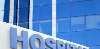 Hospital sign in front of modern glass building