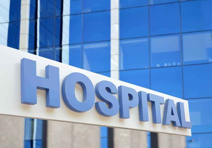 Hospital sign in front of modern glass building