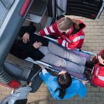 Subway FIREBALL Injures 14 — What HAPPENED! Paramedics load a patient on a stretcher into an ambulance