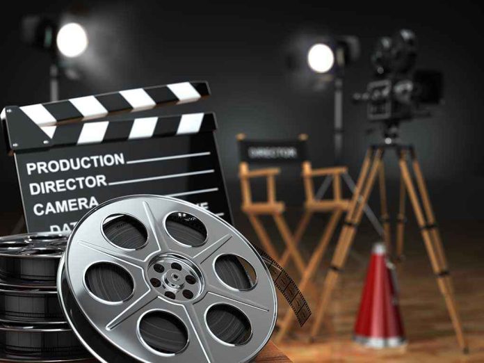 226081837 Movie set with film reels and clapperboard.