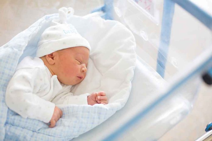 shutterstock_1005877087-1 Newborn baby sleeping in hospital bassinet