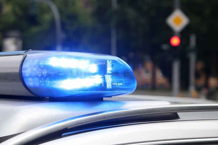 shutterstock_1008710953-2 Police car blue siren light flashing