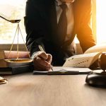 A Court Order Came In For 4 Kids — The Judge Had Never SEEN It Lawyer writing at desk with scales and gavel