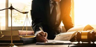 A Court Order Came In For 4 Kids — The Judge Had Never SEEN It Lawyer writing at desk with scales and gavel