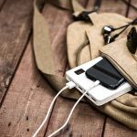 RECALL: The Charger That Explodes — Its Seller REFUSED To Pull It Beige backpack with phone charging on power bank and sunglasses