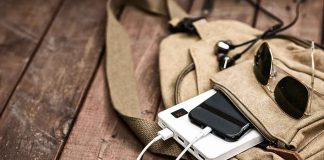 RECALL: The Charger That Explodes — Its Seller REFUSED To Pull It Beige backpack with phone charging on power bank and sunglasses