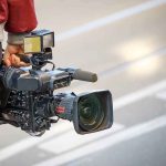 Heart-Stopping Save Caught on VIDEO camera operator carrying a professional video camera