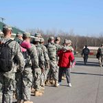 Army Base BLOODSHED, Truth Still Murky Soldiers in uniform line up outdoors with gear