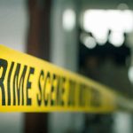 Family Dinner Turns Deadly Over BIZARRE Disagreement crime scene tape in a blurred indoor setting