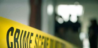 Family Dinner Turns Deadly Over BIZARRE Disagreement crime scene tape in a blurred indoor setting