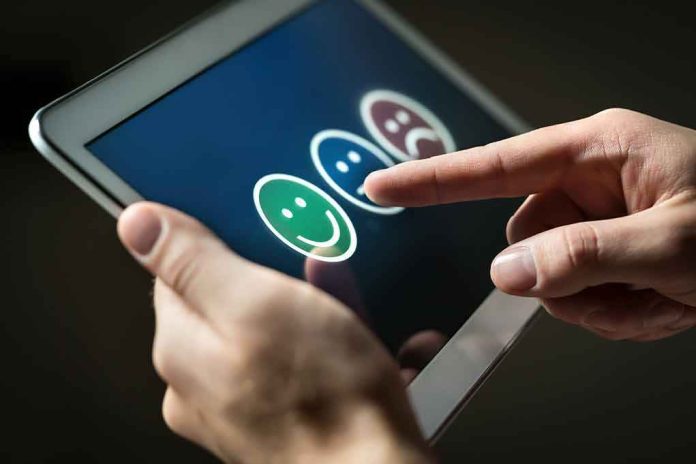 Hands using a tablet to select a happy face rating