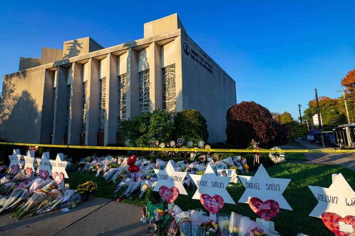 shutterstock_1216488064-1 Synagogue exterior with memorial flowers and star-shaped tributes on lawn