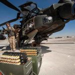 Strait of Hormuz Tension: U.S. Forces Strike attack helicopter on tarmac with crew and ammunition crates