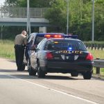 Reckless Gamble Backfires — Celebrity GROUNDED Police officer conducting a traffic stop on a highway