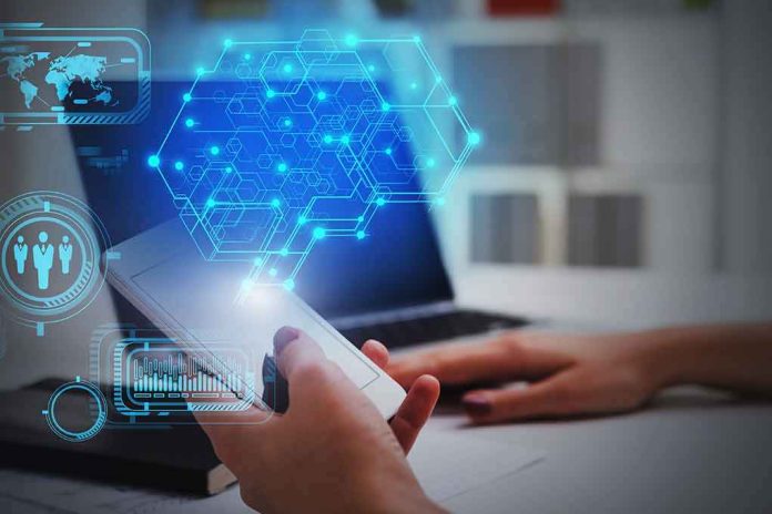 shutterstock_1703593093 Hands using smartphone near laptop with digital hexagon interface overlay