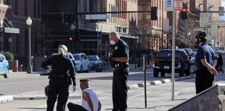 A Car Jumped The Curb At The White House — Then He Made One DEMAND Police officers detain a seated man on a city sidewalk