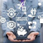 Businessperson holding icons of employee benefits above a smartphone