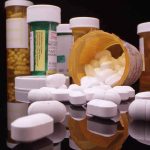 89% Locked In — BIG Pharma’s Worst Nightmare Prescription pill bottles and spilled white tablets